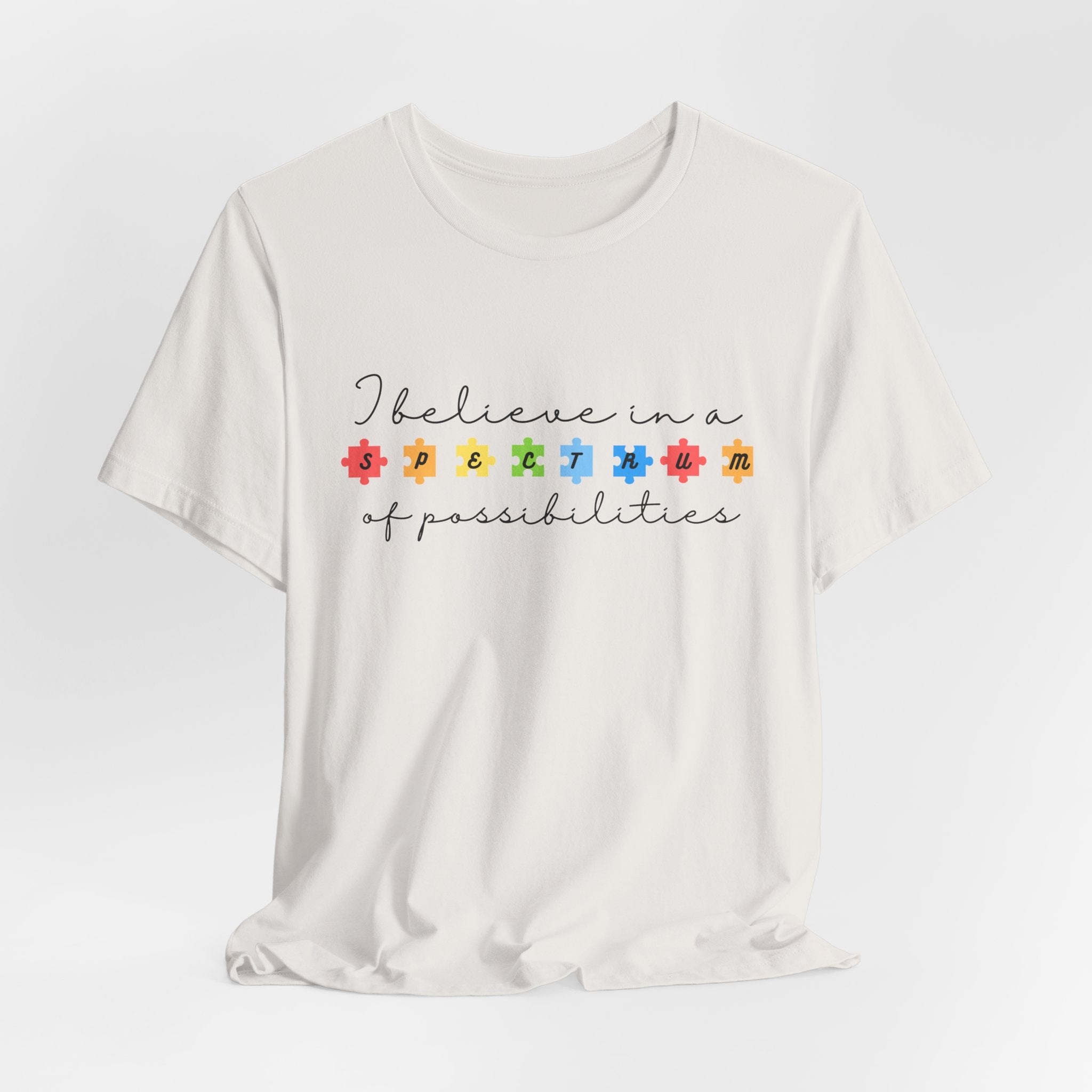 I Believe in a Spectrum of Possibilities T-Shirt | Autism Awareness, Colorful Puzzle Pieces | Black Writing