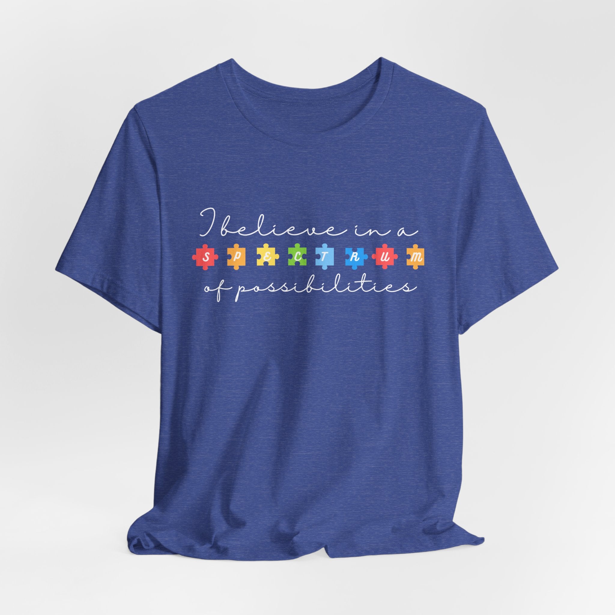 I Believe in a Spectrum of Possibilities T-Shirt | Autism Awareness puzzle pieces | White writing