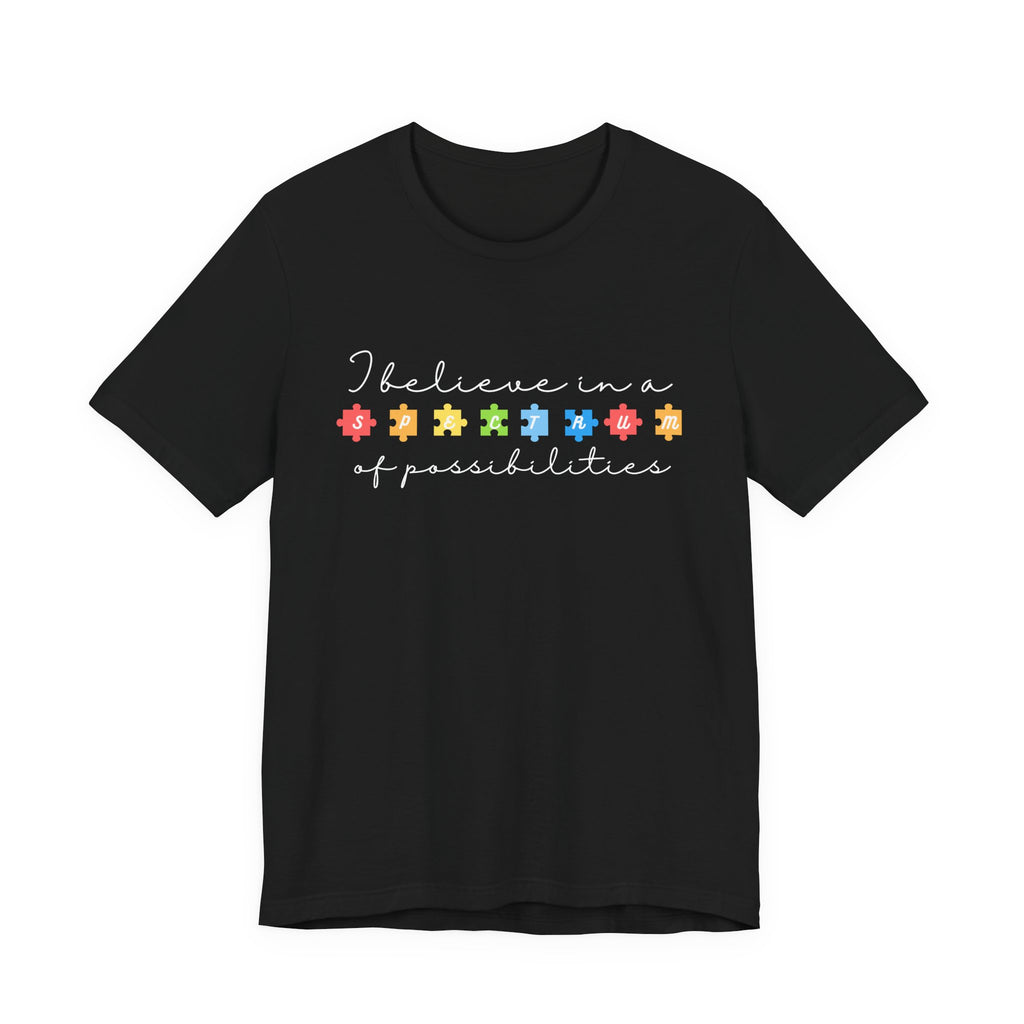 I Believe in a Spectrum of Possibilities T-Shirt | Autism Awareness puzzle pieces | White writing