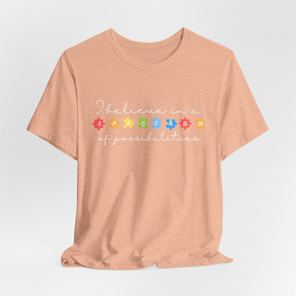 I Believe in a Spectrum of Possibilities T-Shirt | Autism Awareness puzzle pieces | White writing
