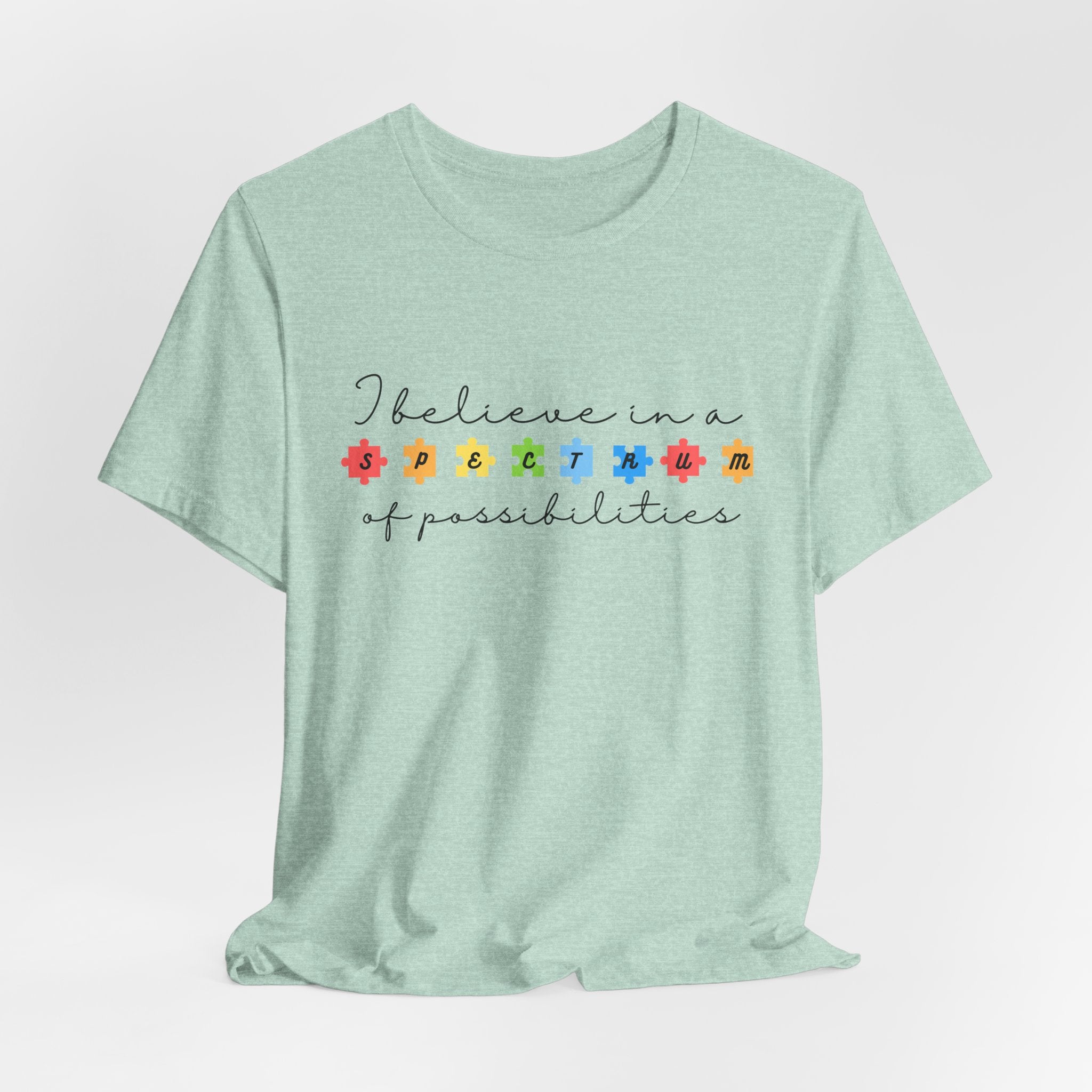 I Believe in a Spectrum of Possibilities T-Shirt | Autism Awareness, Colorful Puzzle Pieces | Black Writing