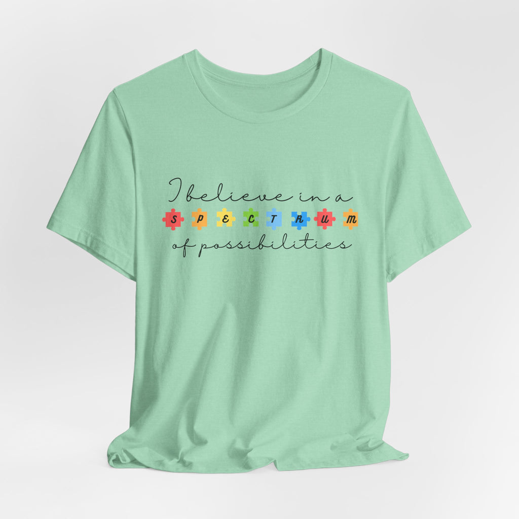 I Believe in a Spectrum of Possibilities T-Shirt | Autism Awareness, Colorful Puzzle Pieces | Black Writing