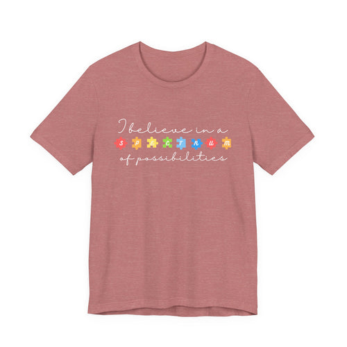 I Believe in a Spectrum of Possibilities T-Shirt | Autism Awareness puzzle pieces | White writing