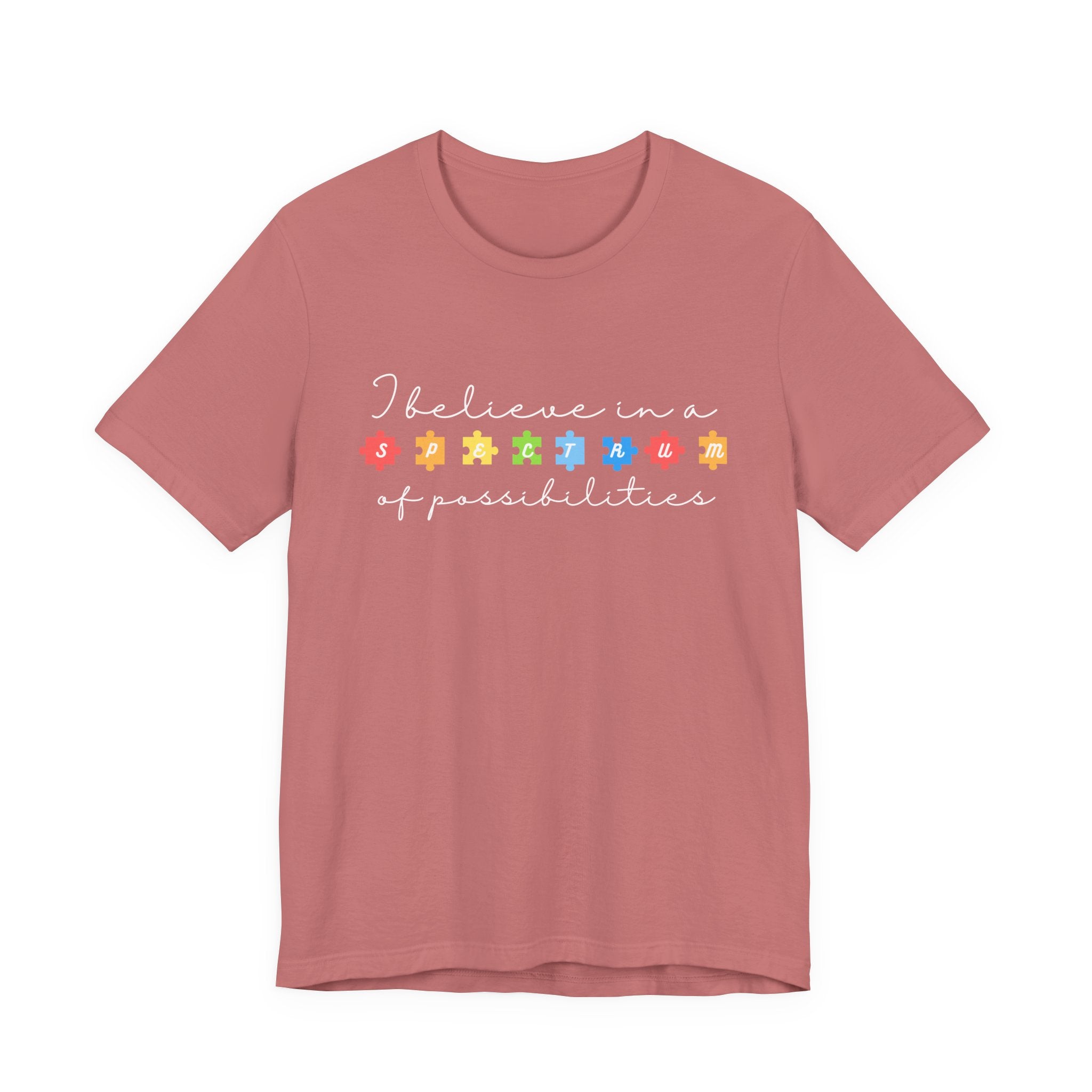 I Believe in a Spectrum of Possibilities T-Shirt | Autism Awareness puzzle pieces | White writing