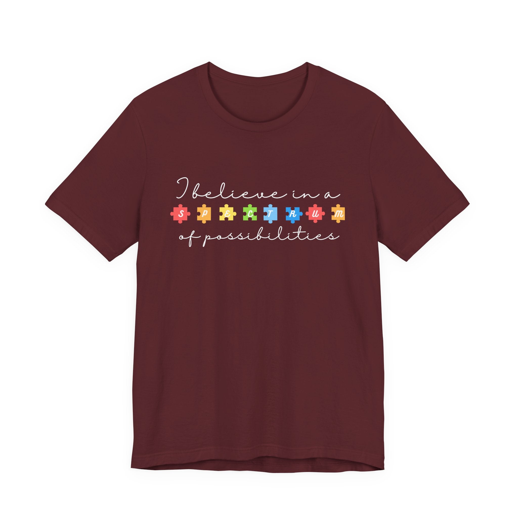 I Believe in a Spectrum of Possibilities T-Shirt | Autism Awareness puzzle pieces | White writing
