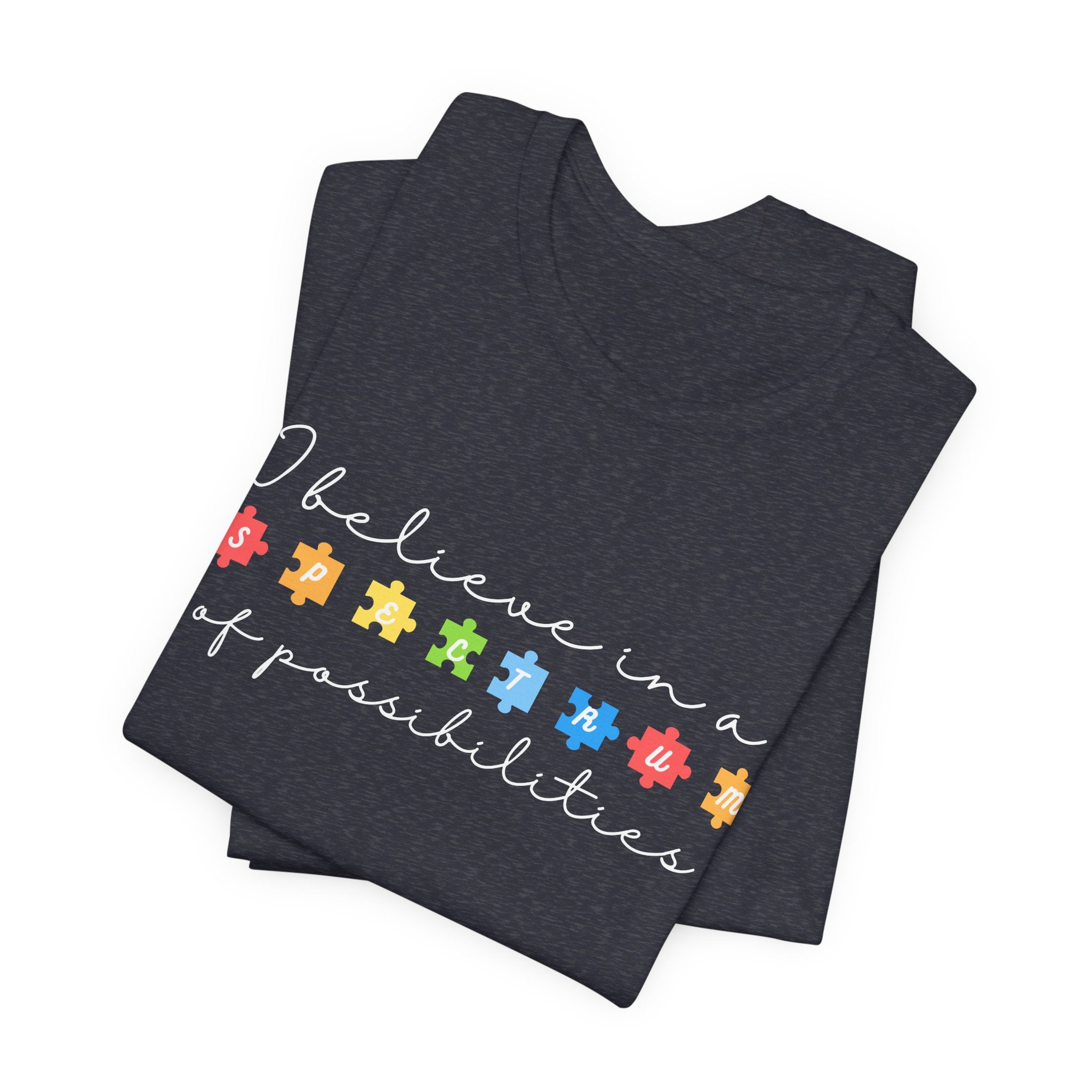 I Believe in a Spectrum of Possibilities T-Shirt | Autism Awareness puzzle pieces | White writing