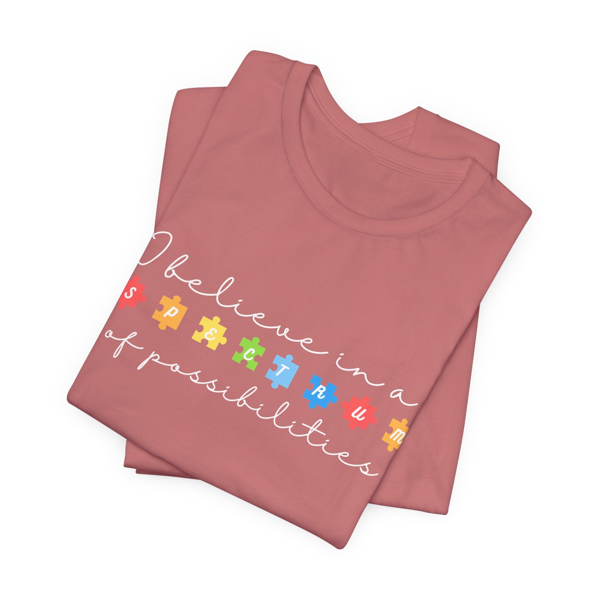 I Believe in a Spectrum of Possibilities T-Shirt | Autism Awareness puzzle pieces | White writing