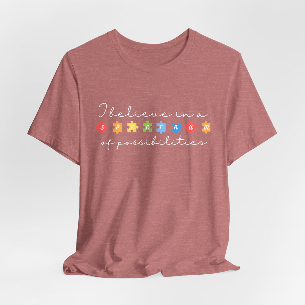 I Believe in a Spectrum of Possibilities T-Shirt | Autism Awareness puzzle pieces | White writing