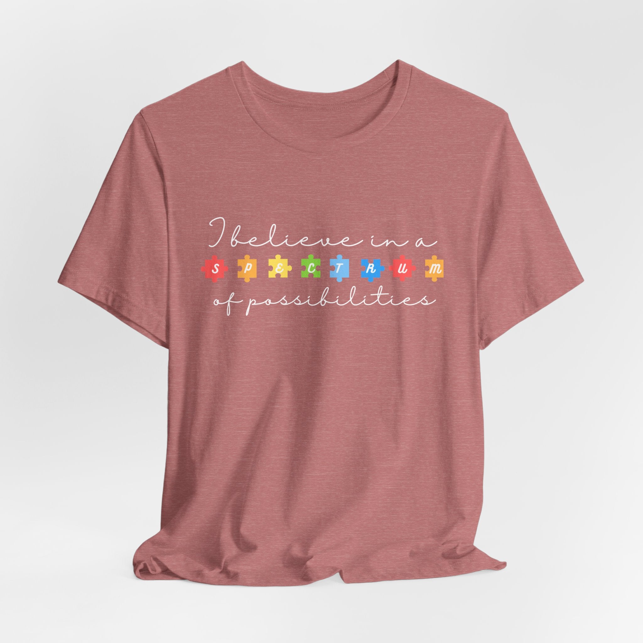 I Believe in a Spectrum of Possibilities T-Shirt | Autism Awareness puzzle pieces | White writing