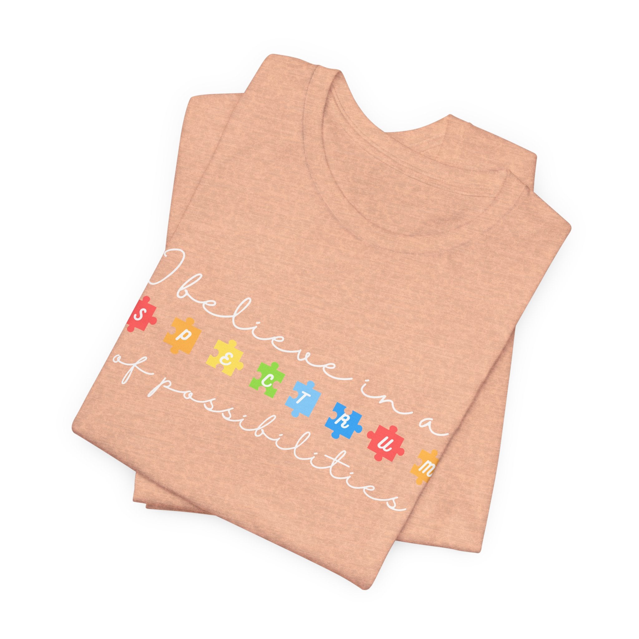 I Believe in a Spectrum of Possibilities T-Shirt | Autism Awareness puzzle pieces | White writing