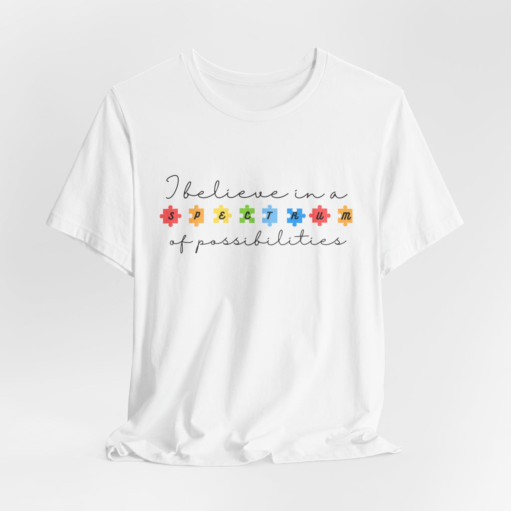 I Believe in a Spectrum of Possibilities T-Shirt | Autism Awareness, Colorful Puzzle Pieces | Black Writing