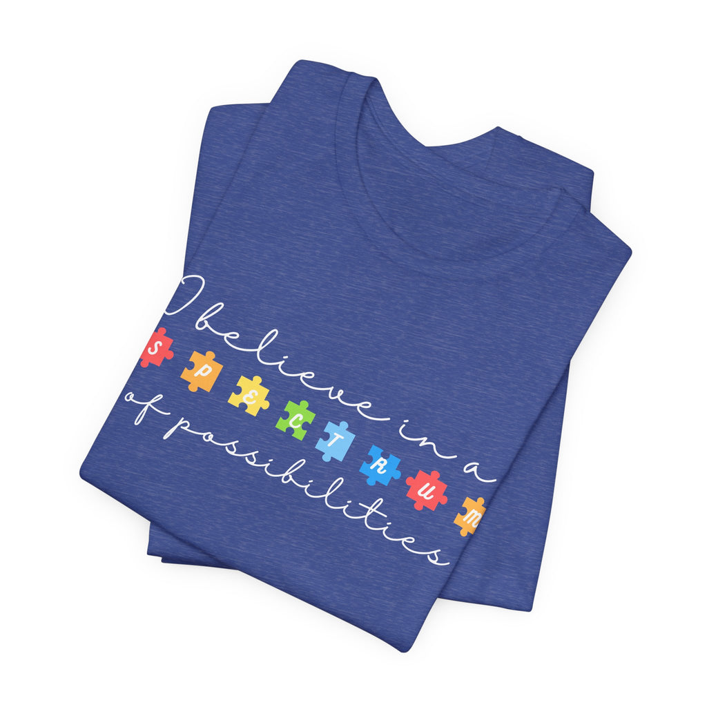 I Believe in a Spectrum of Possibilities T-Shirt | Autism Awareness puzzle pieces | White writing
