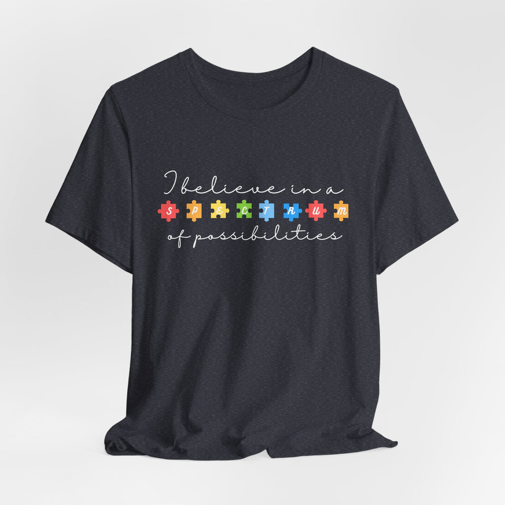 I Believe in a Spectrum of Possibilities T-Shirt | Autism Awareness puzzle pieces | White writing